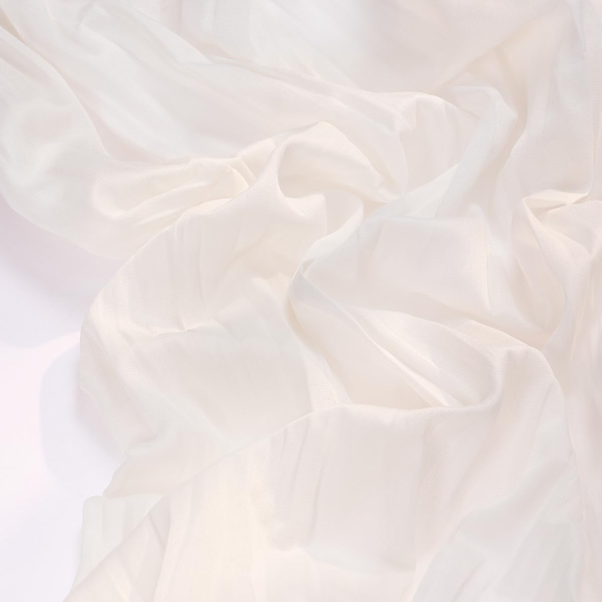 Socomi ivory cheesecloth runner drapes wedding arches with effortless elegance.