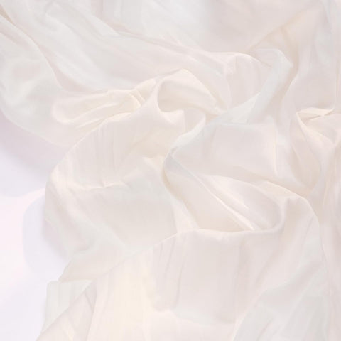 Socomi ivory cheesecloth runner drapes wedding arches with effortless elegance.