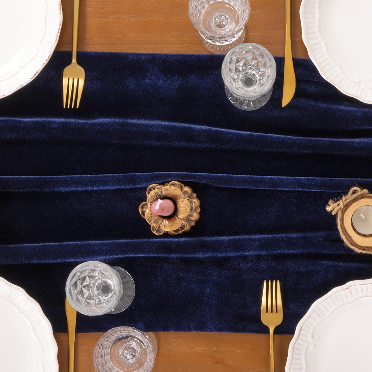 Socomi navy velvet runner used as backdrop to create luxe decor.