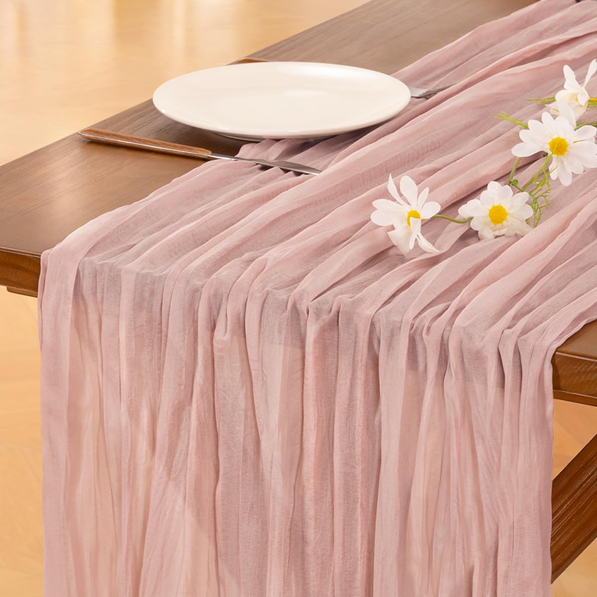Socomi pink cheesecloth table runner draped elegantly to create a soft rustic table setting.