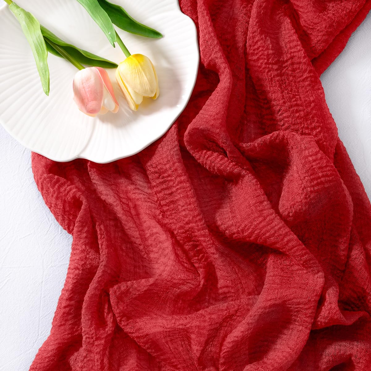 Socomi red cheesecloth runner for Valentine's Day tables with romantic appeal.