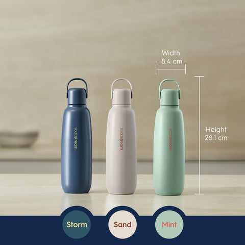 SodaStream Fizz & Go Cool Sand bottle in car cupholder, travel-friendly.