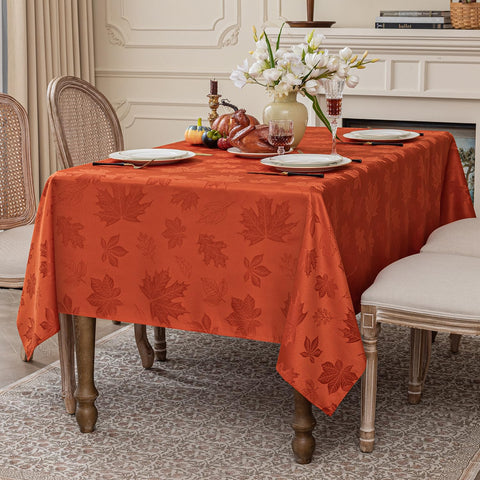 Softalker burnt orange harvest tablecloth adds warm seasonal decor.
