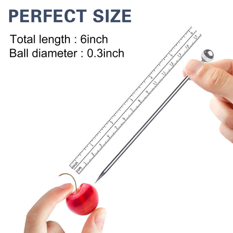 SOGEWO 6-inch cocktail picks in a martini glass for precise garnish