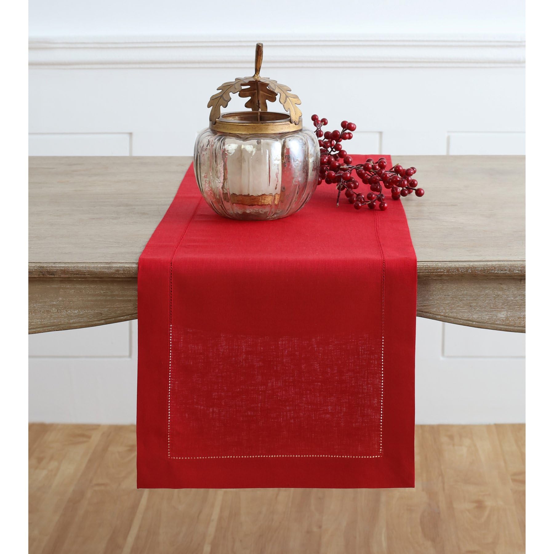 Solino Home red linen runner close-up with hemstitched edge for elegance.