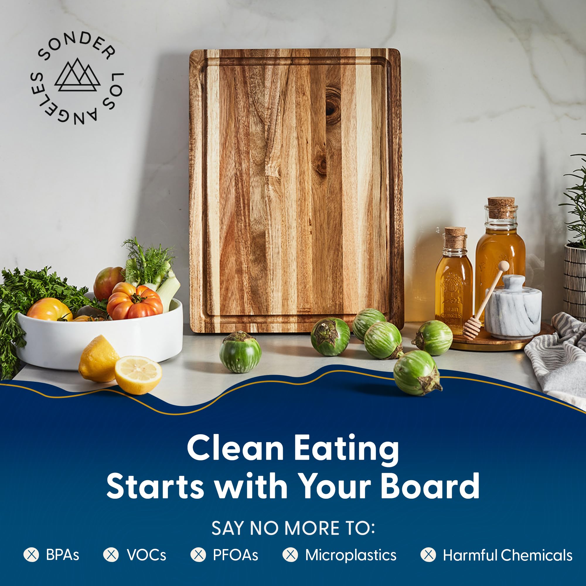 Sonder Los Angeles Winsome Acacia board with juice groove catching liquids