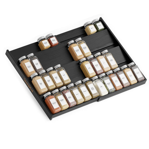 SpaceAid bamboo black spice drawer organizer neatly arranges jars in a deep drawer.