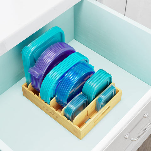 SpaceAid bamboo lid organizer in a kitchen cabinet with natural warm finish.