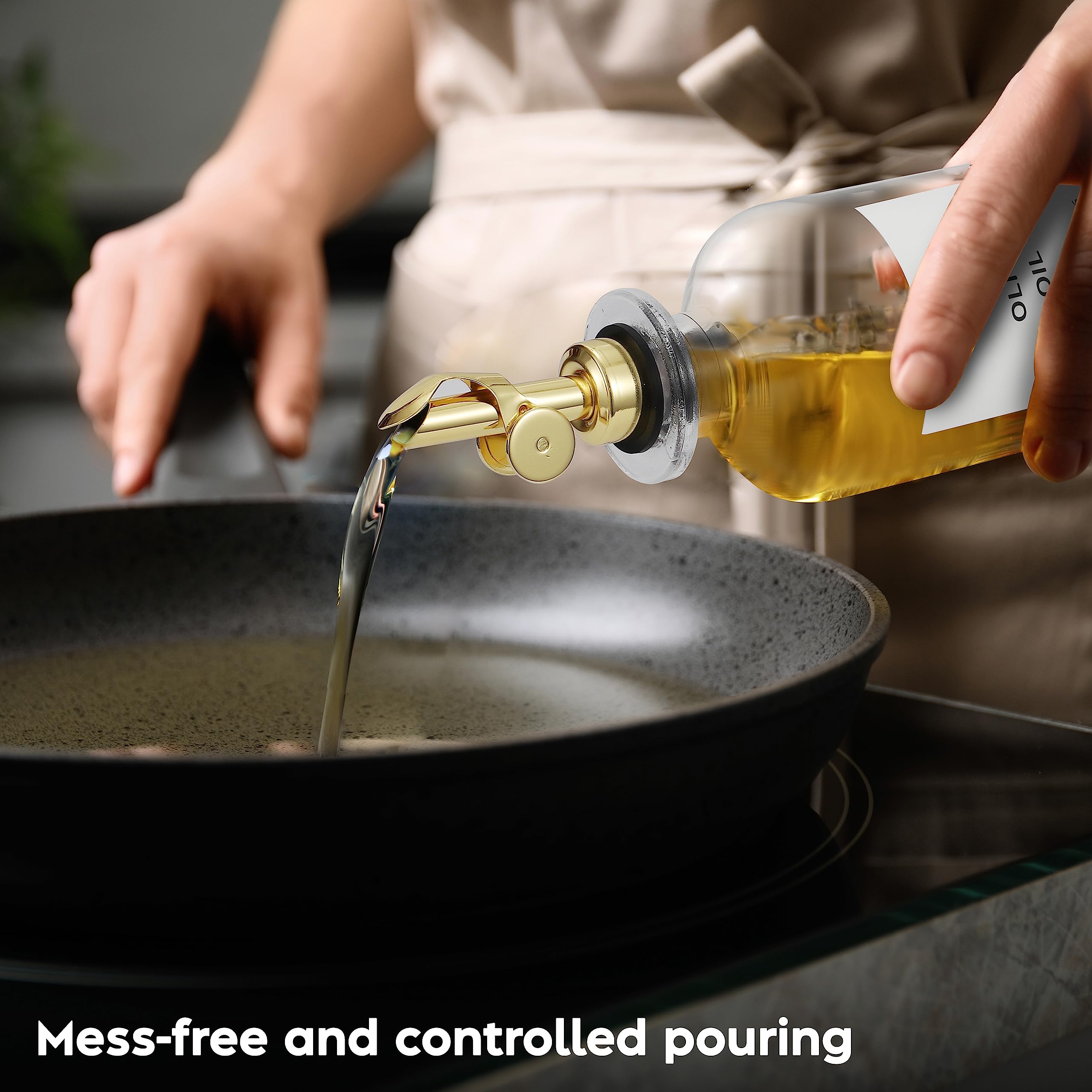 Spaceneat gold-plated pourer adds elegant touch to kitchen tasks.