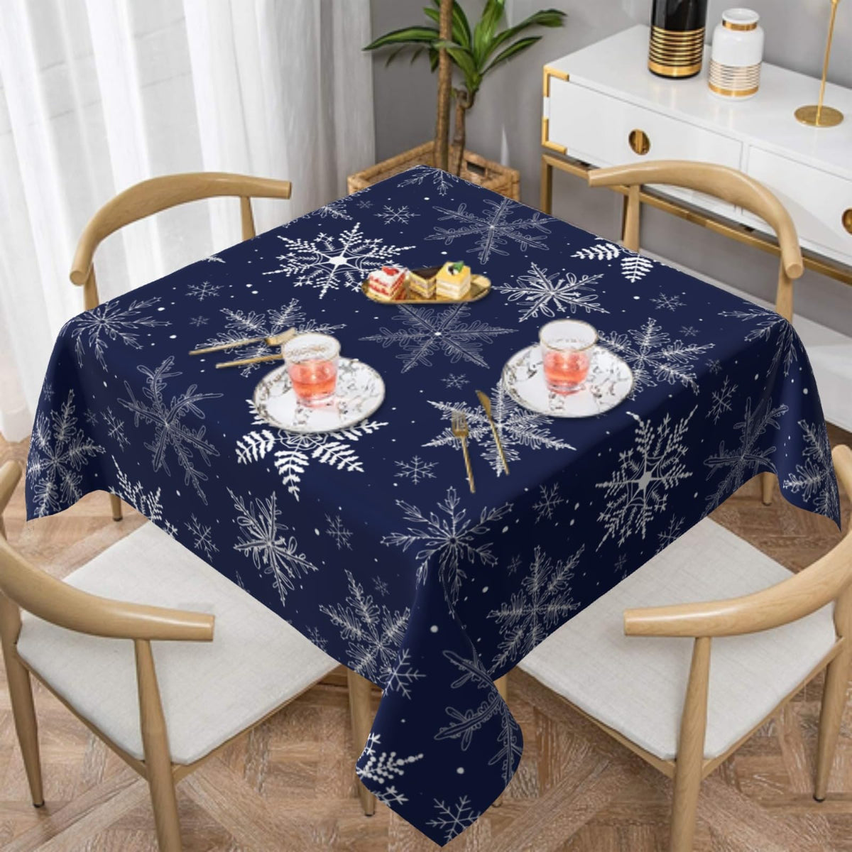 Sphragiyn winter tablecloth with blue snowflakes, ideal for festive dining and easy cleanup.