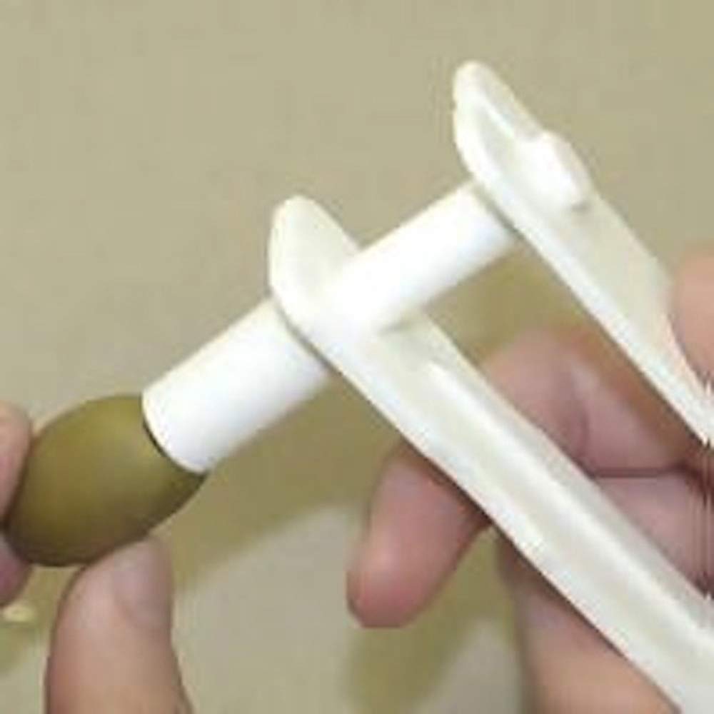 Spill-Stop Olive Express Stuffer chamber loading demonstrates fast filling with minimal effort