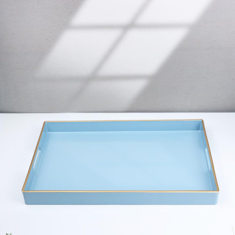 Spsyrine blue tray used for snacks and beverages on a table.