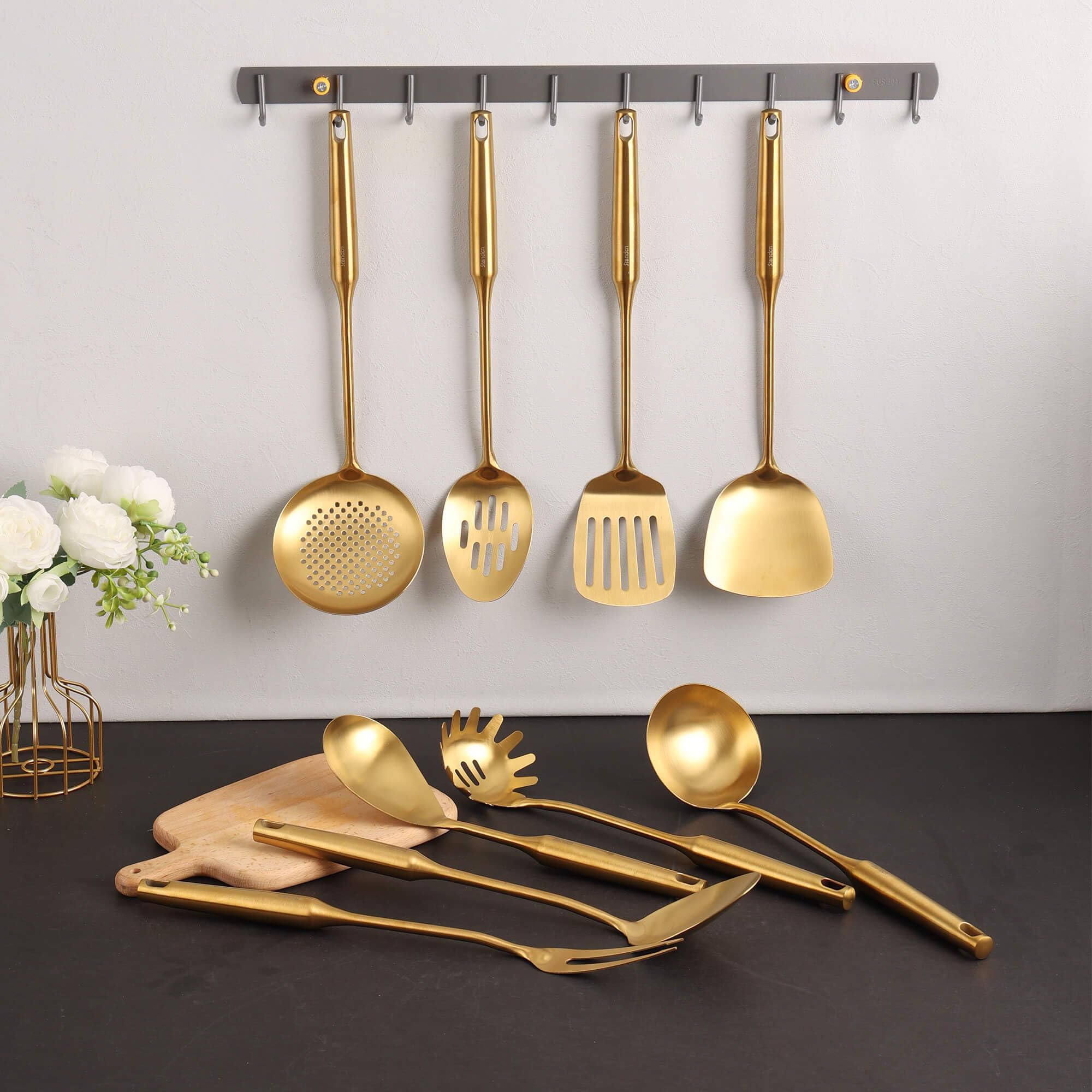 Standcn Gold Utensils Pasta Spoon ready to lift pasta with sauce