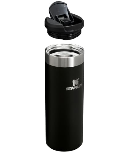 Stanley AeroLight bottle resting in car cup holder, ultralight for daily travel.