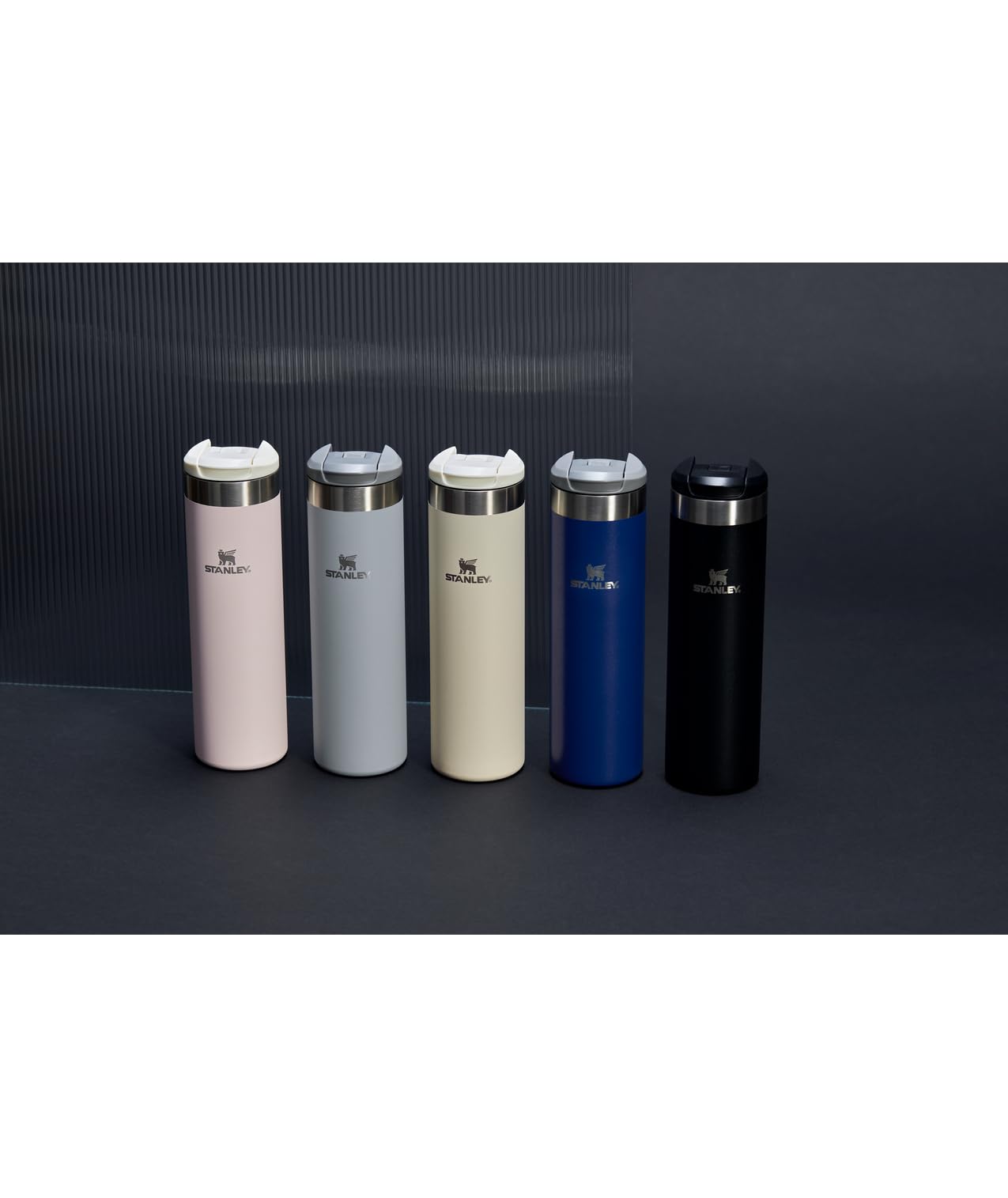 Stanley AeroLight Transit Bottle 20 oz fits car cup holders for easy road hydration.