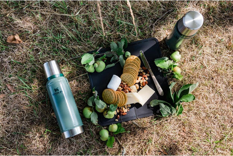 Stanley Classic 20 oz bottle packed in a backpack for on-the-go hydration.