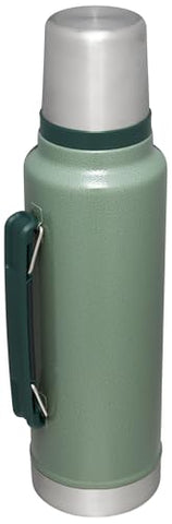 Stanley leakproof cup lid shown with bottle to prevent spills during travel.