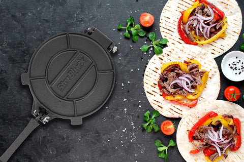 StarBlue tortilla press in use with dough being pressed evenly