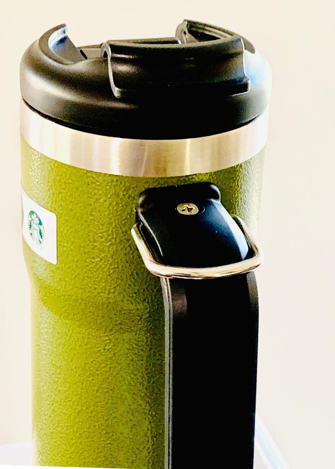 Starbucks Stanley double-wall tumbler maintains hot or cold beverages on the go.