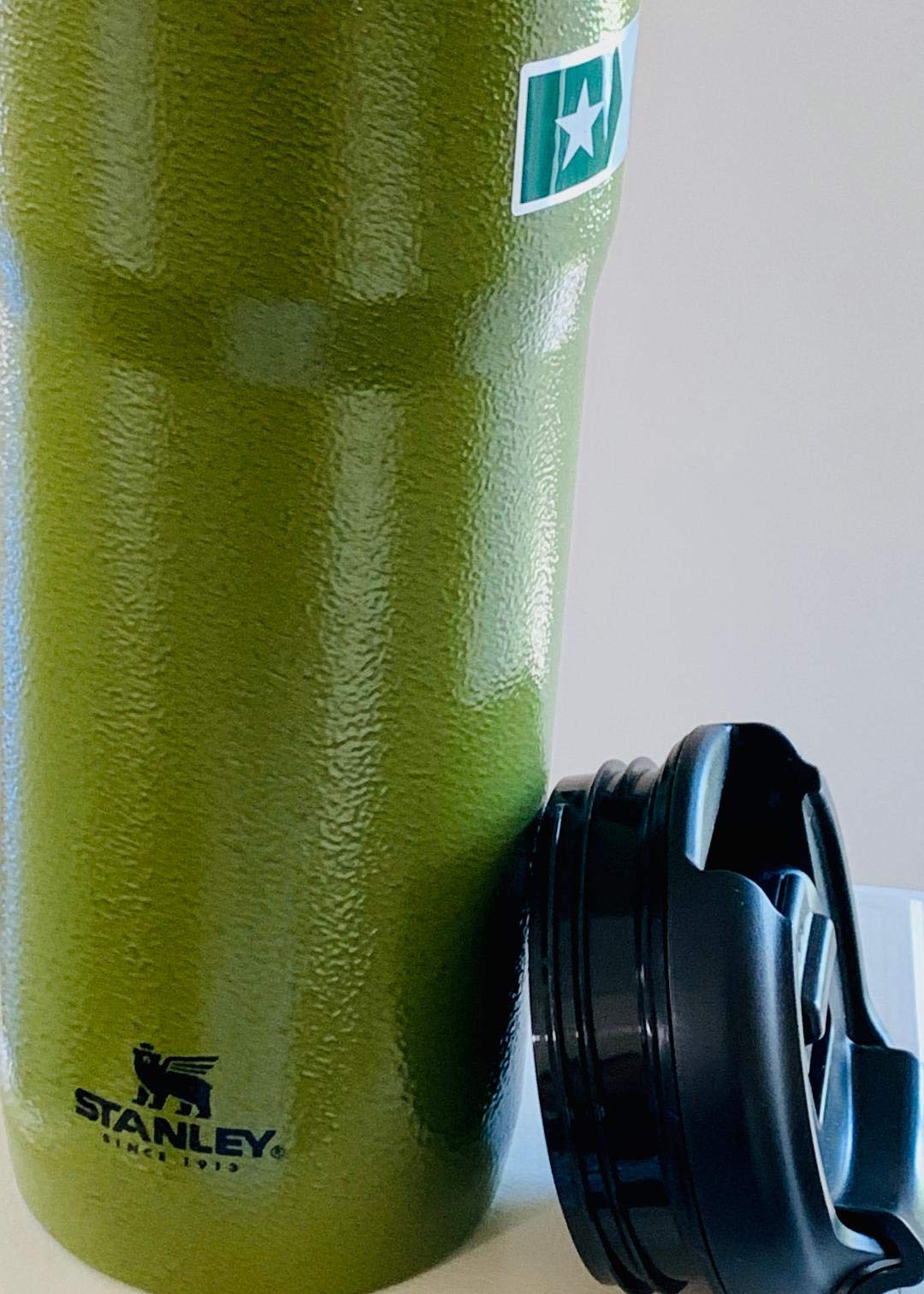 Starbucks Stanley military green 20 oz tumbler ideal for hot coffee or cold drinks.