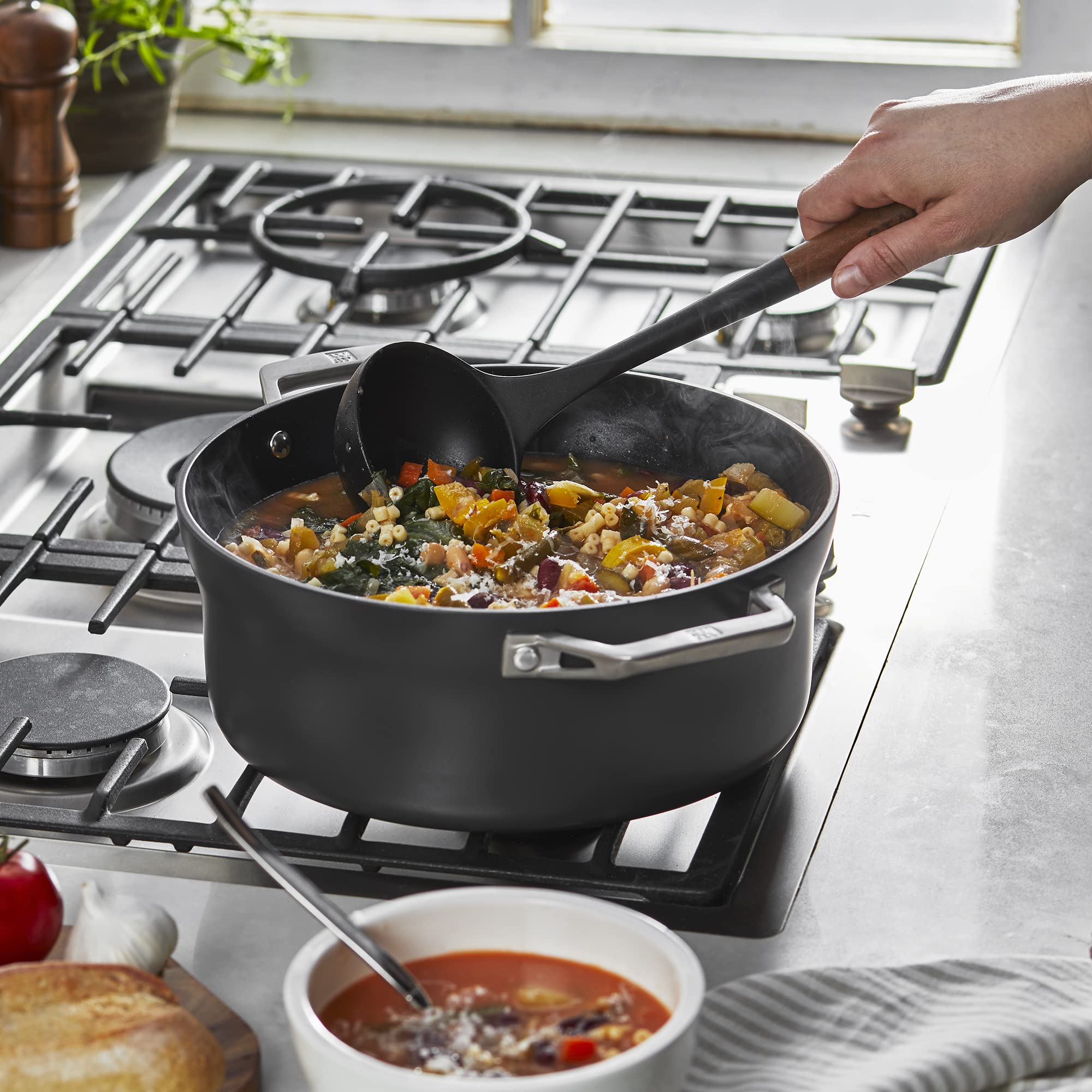 STAUB ladle showcases the acacia wood handle with ergonomic grip.