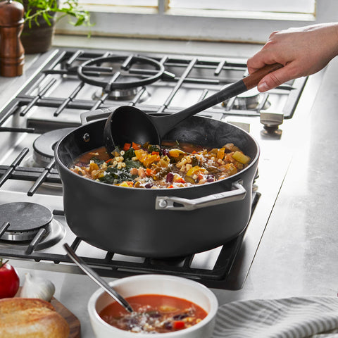 STAUB ladle showcases the acacia wood handle with ergonomic grip.