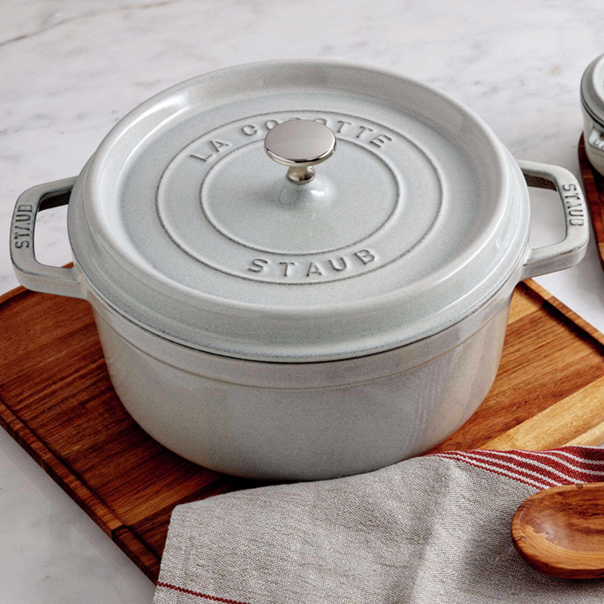 STAUB cast-iron cocotte with matte black enamel interior promotes browning.