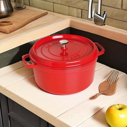 STAUB nickel knob on lid withstands high oven heat for versatile cooking.