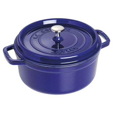 Staub 4qt round cocotte in dark blue, durable enamel for slow-cooked meals.
