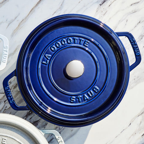 Staub cocotte interior matte enamel supports even browning and searing.