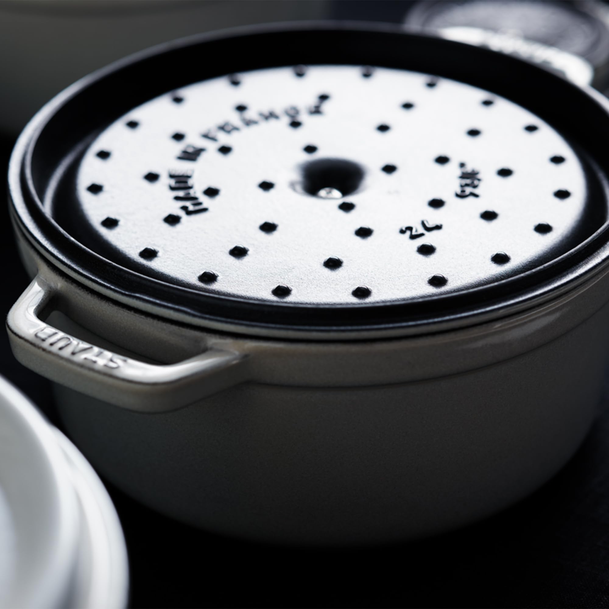 STAUB smooth enamel bottom works on induction and other stovetops.