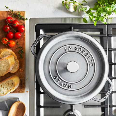 Staub Dutch oven with lid on highlights self-basting spikes for moist braising.
