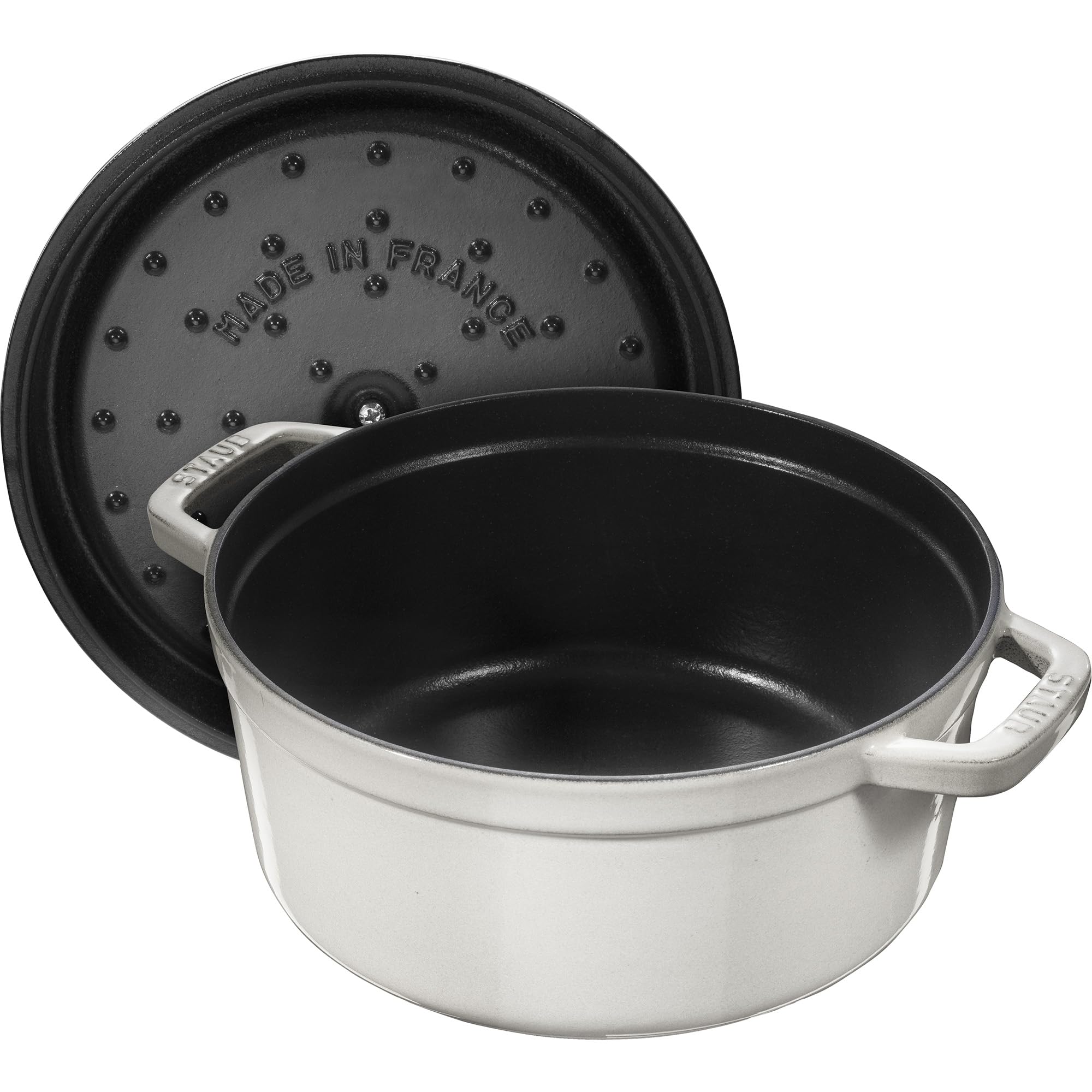 Hefty STAUB cocotte with tight lid preserves moisture during slow simmering.