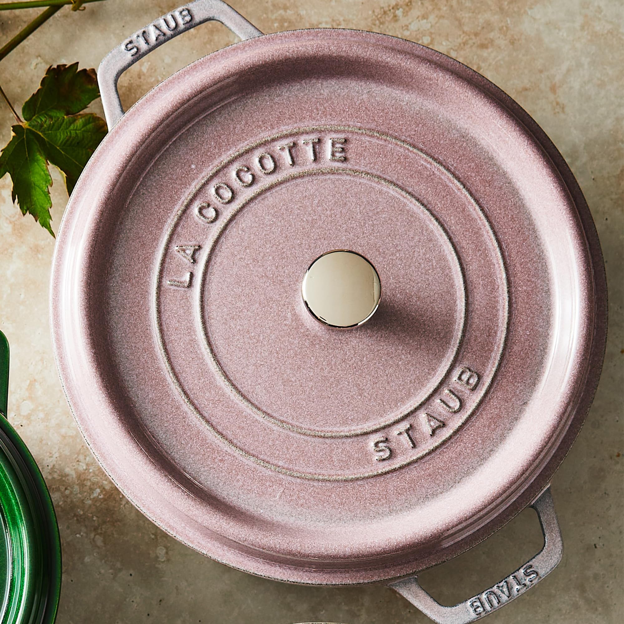 Staub lilac dutch oven lid spikes promote moisture return for juicy dishes