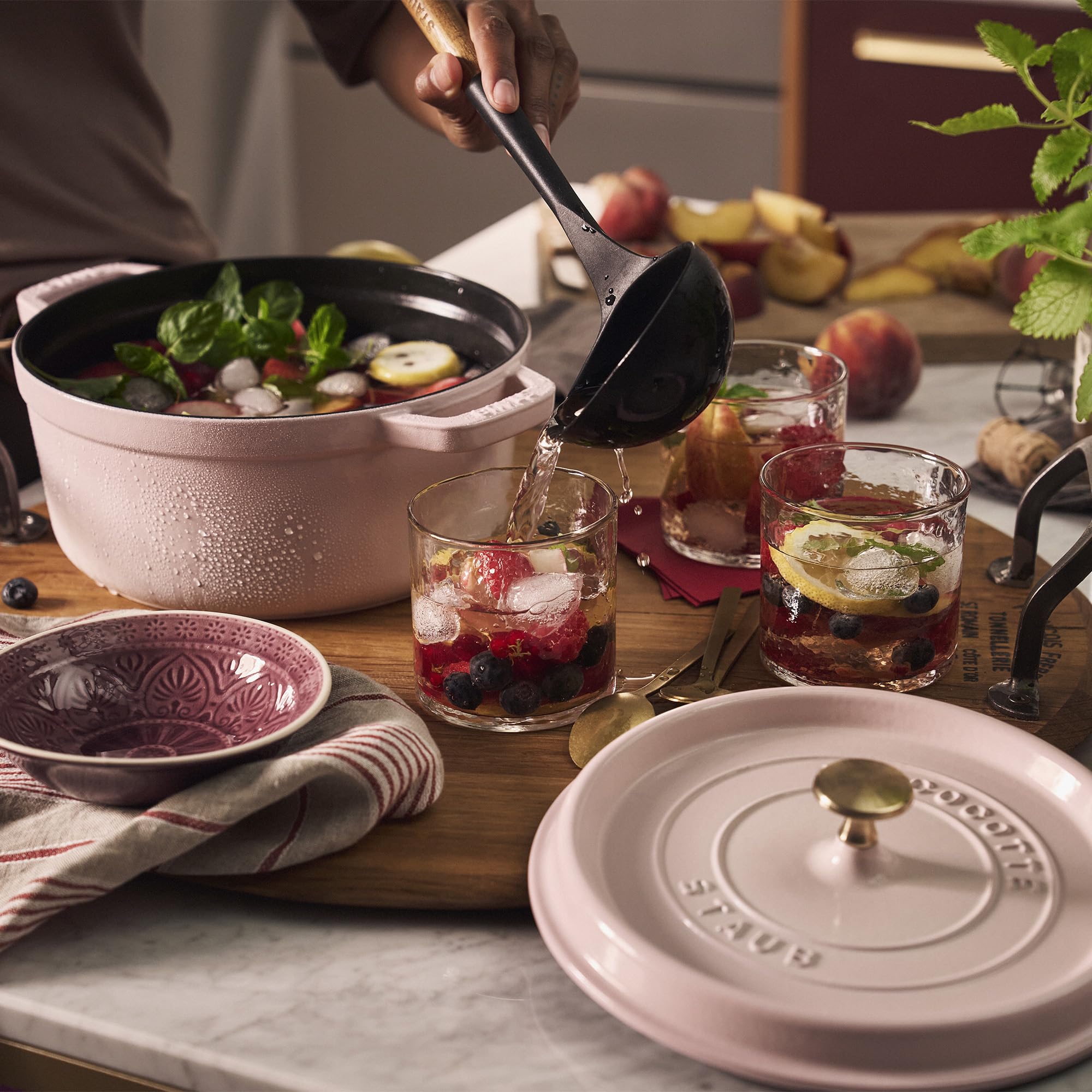 Staub Peony Pink Dutch Oven with lid on ensures moist, braised results.