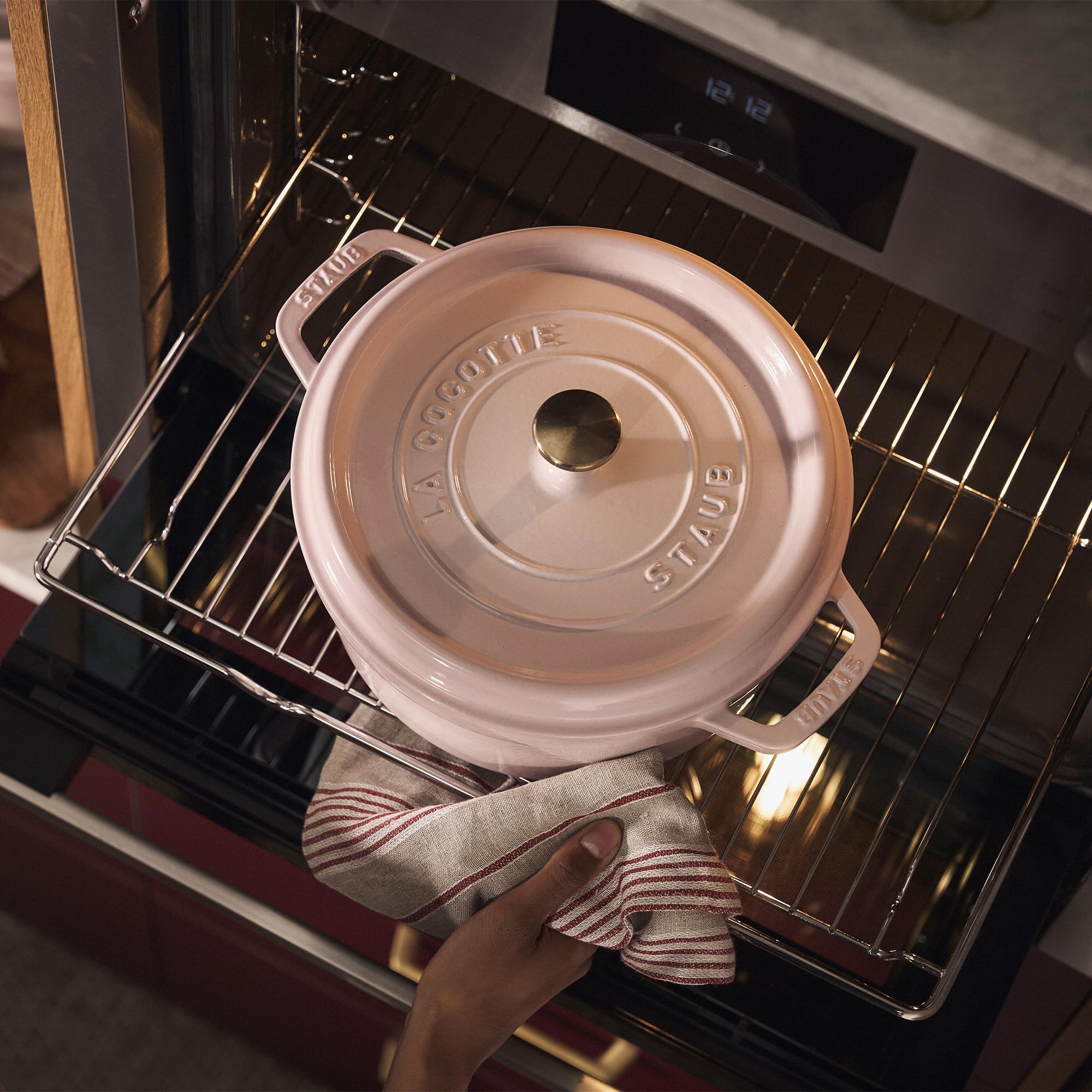 Staub Peony Pink enamel interior supports browning and simmering.
