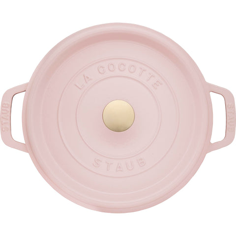 Staub Peony Pink on stovetop works across gas, electric, ceramic, and induction.