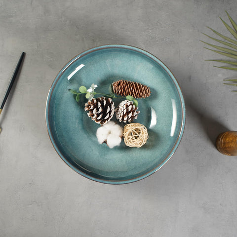 STE-CER ceramic bowl on countertop holds fruits and snacks neatly.