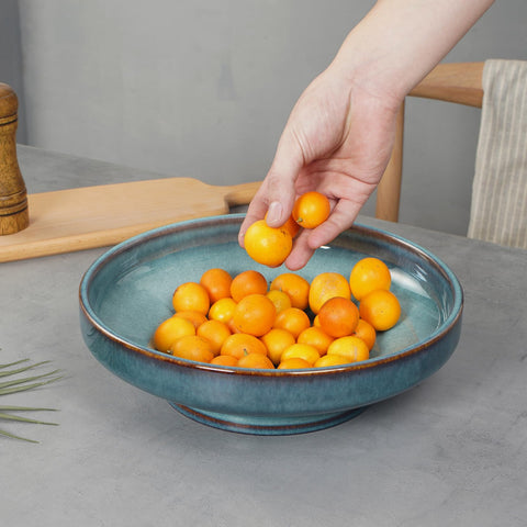 STE-CER blue glazed pedestal bowl adds vintage charm to dining tables.