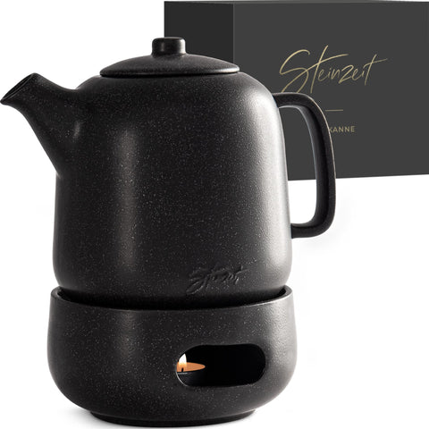Steinzeit Design Tea Pot with Warmer—sleek black ceramic exterior for heat retention.