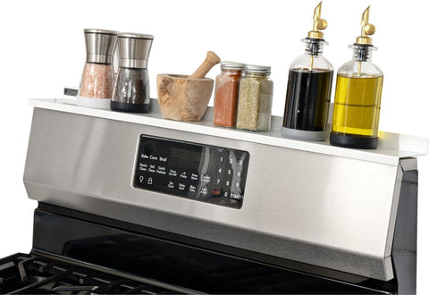 Stove Shelf magnetic shelf on stove top keeps spices within easy reach.