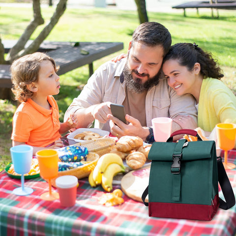 SUNNY BIRD lunchbox tote in green shown in everyday use.