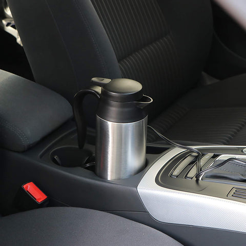 Sunsbell compact kettle located in a car cup holder for easy access.