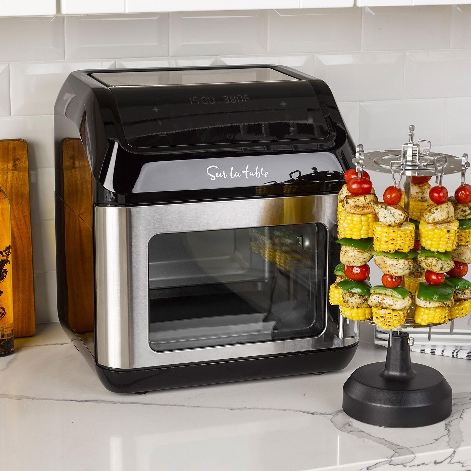 Sur La Table left hinge air fryer angled touchscreen for easy, quick presets.
