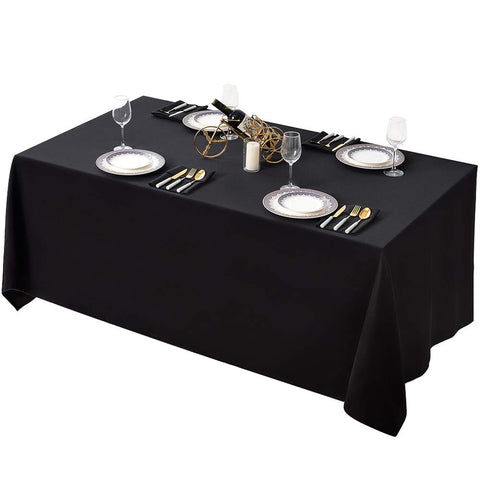 Surmente black tablecloth 90x132 on a rectangular table for elegant coverage.
