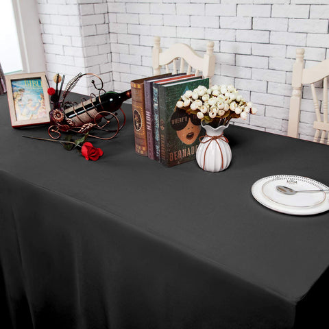 Durable polyester Surmente black tablecloth on a 6-foot table