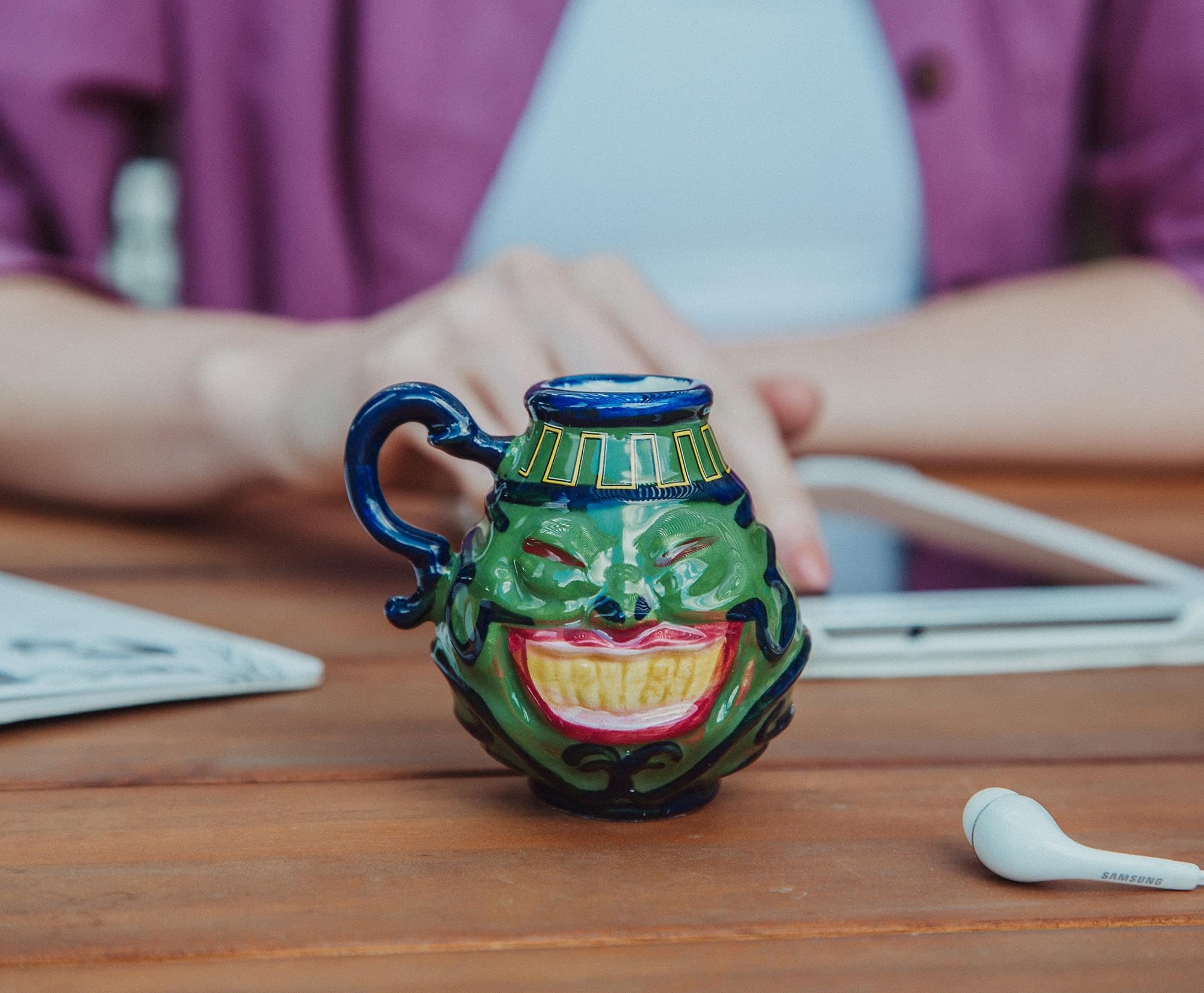 Surreal Entertainment Pot Of Greed mini mug holds about 2 ounces for small sips.