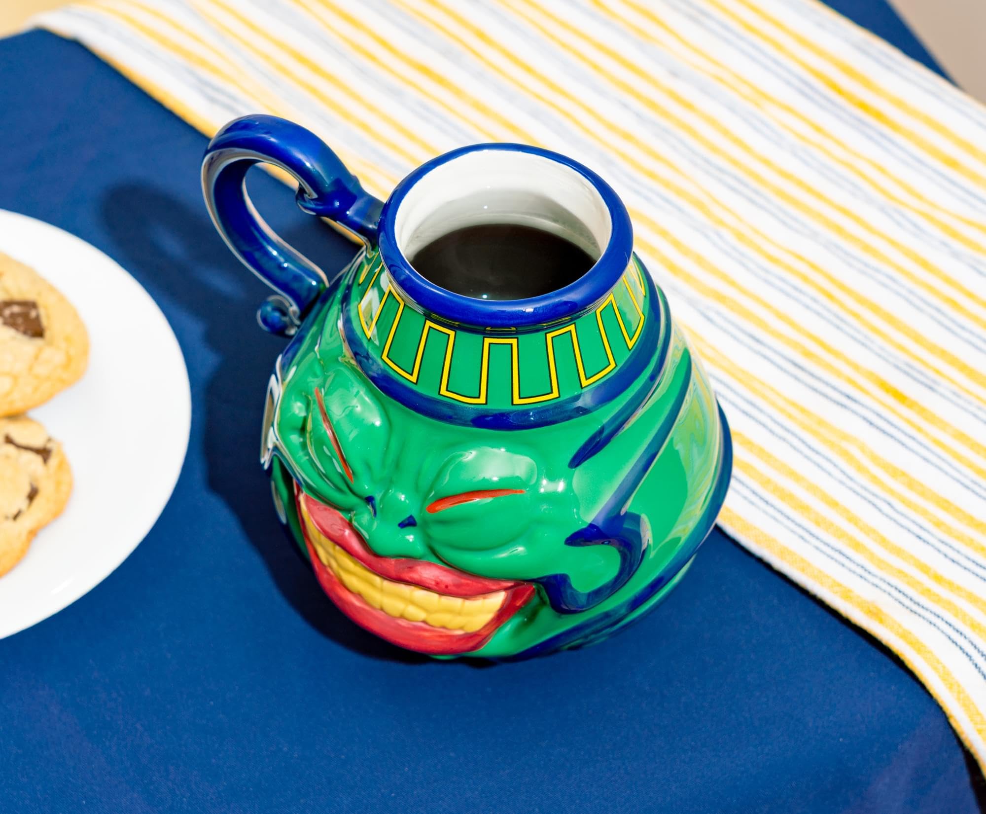 Surreal Entertainment Pot of Greed mug, on a desk as a playful accent.