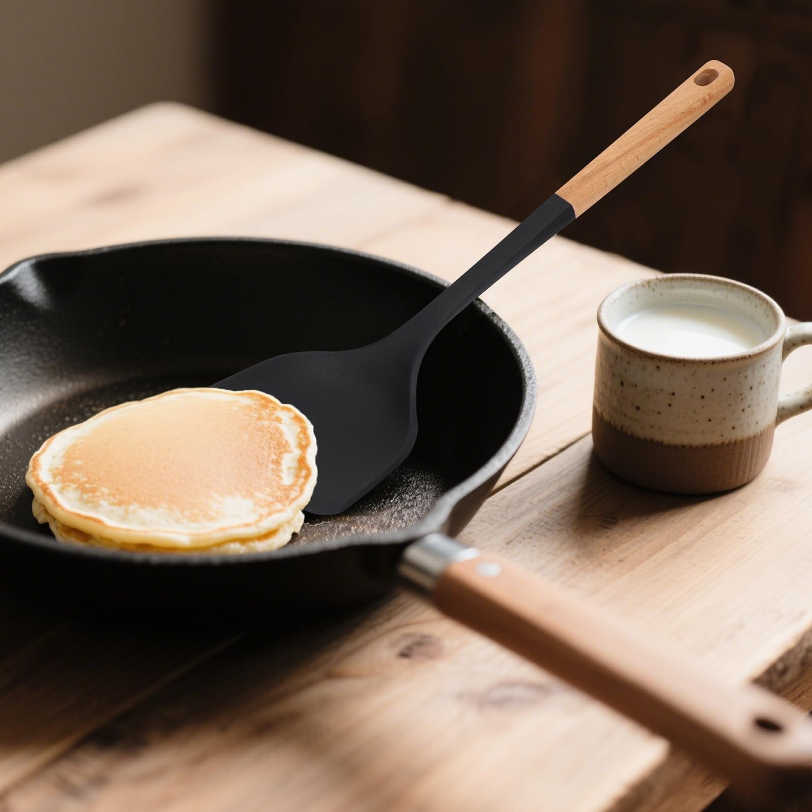 Svailse silicone spatula curved edge reaches pot corners.