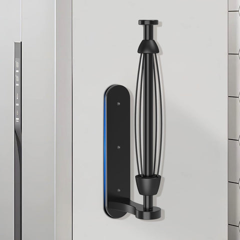 Swaitee magnetic paper towel holder mounted on a refrigerator for easy one-handed tearing.
